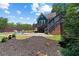Beautiful backyard with manicured lawn, fire pit, and deck, creating a perfect outdoor retreat at 429 Oakland Ave, Atlanta, GA 30312