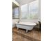 Bathroom showcasing a soaking tub with plenty of natural light streaming through the window at 429 Oakland Ave, Atlanta, GA 30312