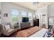 Bright bedroom featuring a large window, entertainment center, and a cozy sitting area at 429 Oakland Ave, Atlanta, GA 30312