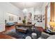 Spacious dining room with hardwood floors, chandelier, and cozy seating area at 429 Oakland Ave, Atlanta, GA 30312