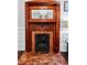 Intricate wooden fireplace with brick interior at 429 Oakland Ave, Atlanta, GA 30312
