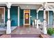 Inviting front porch with seating and a decorative door, enhanced with classic architectural details at 429 Oakland Ave, Atlanta, GA 30312
