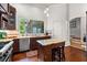 Bright kitchen features granite countertops, stainless steel appliances, an island, and a view of the porch at 429 Oakland Ave, Atlanta, GA 30312