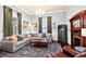 Cozy living room with a fireplace, sectional sofa, and ample natural light at 429 Oakland Ave, Atlanta, GA 30312