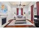 Serene main bedroom with a fireplace, neutral tones, and decorative curtains at 429 Oakland Ave, Atlanta, GA 30312