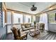 Cozy screened-in porch featuring comfortable seating, decorative lighting, and a relaxing atmosphere at 429 Oakland Ave, Atlanta, GA 30312