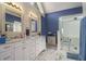 Bathroom featuring a double vanity, marble floors, and a glass shower at 2525 Highbrooke Trl, Duluth, GA 30097