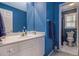 Bathroom featuring white vanity and blue walls at 2525 Highbrooke Trl, Duluth, GA 30097