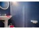 Stylish powder room with elegant sink and blue patterned wallpaper, adding character to the home at 2525 Highbrooke Trl, Duluth, GA 30097
