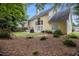 Exterior view of the home with a well-manicured yard and trees at 2525 Highbrooke Trl, Duluth, GA 30097