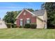 Charming home featuring manicured lawn, brick accents and blue shutters at 2525 Highbrooke Trl, Duluth, GA 30097