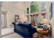 Sunlit living room with high ceilings, large windows, and comfortable seating arrangement at 2525 Highbrooke Trl, Duluth, GA 30097