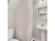 Powder bathroom featuring a pedestal sink, white framed mirror, and tiled flooring at 2957 Smith Ridge Trce, Peachtree Corners, GA 30071