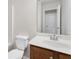 Bathroom features a white sink, wood vanity, and a toilet at 2957 Smith Ridge Trce, Peachtree Corners, GA 30071