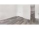 Bedroom featuring hard wood floors and an open view into the stairwell at 2957 Smith Ridge Trce, Peachtree Corners, GA 30071
