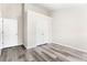 Bedroom featuring hard wood floors, two closets, and neutral walls at 2957 Smith Ridge Trce, Peachtree Corners, GA 30071