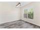 Dining area with hardwood floors, window, and modern lighting at 2957 Smith Ridge Trce, Peachtree Corners, GA 30071