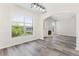 Dining room features natural light with views to the fireplace and living area and grey flooring at 2957 Smith Ridge Trce, Peachtree Corners, GA 30071