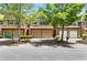 Charming townhomes featuring brick facades, two-car garages, and well-maintained landscaping at 2957 Smith Ridge Trce, Peachtree Corners, GA 30071
