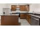 View of a modern kitchen with stainless steel appliances, an island, and granite countertops at 2957 Smith Ridge Trce, Peachtree Corners, GA 30071