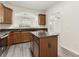 Well-lit kitchen with stainless steel appliances, granite countertops, and an island, adjacent to dining at 2957 Smith Ridge Trce, Peachtree Corners, GA 30071