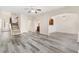 Bright living area featuring open concept layout with hardwood floors and archways at 2957 Smith Ridge Trce, Peachtree Corners, GA 30071