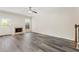A spacious living room featuring hardwood floors, a fireplace, and natural light at 2957 Smith Ridge Trce, Peachtree Corners, GA 30071