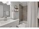 Well-lit bathroom features updated fixtures, including a shower/tub combination, and a vanity with storage at 756 Joseph E Lowery Sw Blvd, Atlanta, GA 30310