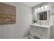 Bright bathroom featuring a white vanity with drawers, a modern mirror, and stylish decor at 756 Joseph E Lowery Sw Blvd, Atlanta, GA 30310