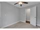 Comfortable bedroom with carpeted floors, a ceiling fan, and easy access to the ensuite bathroom at 756 Joseph E Lowery Sw Blvd, Atlanta, GA 30310