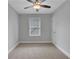 Cozy bedroom with plush carpeting, neutral walls, and a bright window at 756 Joseph E Lowery Sw Blvd, Atlanta, GA 30310