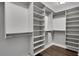 Walk-in closet with custom shelving and hardwood floors at 756 Joseph E Lowery Sw Blvd, Atlanta, GA 30310