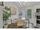 Bright dining area featuring modern lighting and access to the outdoor patio at 756 Joseph E Lowery Sw Blvd, Atlanta, GA 30310