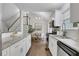 Open kitchen flowing into dining area, with granite countertops and stainless steel appliances at 756 Joseph E Lowery Sw Blvd, Atlanta, GA 30310