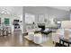 Open-concept living room with fireplace and seamless flow to dining area at 756 Joseph E Lowery Sw Blvd, Atlanta, GA 30310