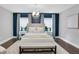 Bright bedroom with accent wall, modern lighting, and plush bedding at 756 Joseph E Lowery Sw Blvd, Atlanta, GA 30310