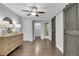 Bedroom features hardwood floors, dresser, walk-in closet and view into ensuite bath at 756 Joseph E Lowery Sw Blvd, Atlanta, GA 30310