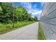 Scenic walking path with lush greenery and trees along the side at 756 Joseph E Lowery Sw Blvd, Atlanta, GA 30310