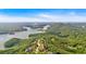 Breathtaking aerial view of the lake and the surrounding mountains and forest with neighborhood nestled within at 89 Somerset Ln, Cartersville, GA 30121