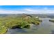 Breathtaking aerial view of a lush, green landscape with a stunning lake and mountains at 89 Somerset Ln, Cartersville, GA 30121