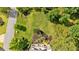 Aerial view of the landscaped backyard with trees and shrubs at 89 Somerset Ln, Cartersville, GA 30121