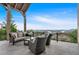 Spacious covered balcony furnished with comfortable seating, offering stunning panoramic views of the lake at 89 Somerset Ln, Cartersville, GA 30121