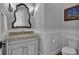 This bathroom features granite countertops, a framed mirror and a toilet in a neutral color at 89 Somerset Ln, Cartersville, GA 30121