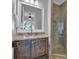 Bathroom features a granite countertop, wooden cabinets, and glass shower at 89 Somerset Ln, Cartersville, GA 30121