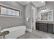 Serene bathroom with a standalone tub and granite vanity at 89 Somerset Ln, Cartersville, GA 30121