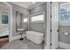 Bright bathroom boasts a soaking tub and lots of natural light at 89 Somerset Ln, Cartersville, GA 30121