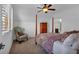 Cozy bedroom with shuttered windows, four poster bed and accent chair at 89 Somerset Ln, Cartersville, GA 30121