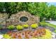 Landscaped entrance to Village at Waterside community with stone signage at 89 Somerset Ln, Cartersville, GA 30121