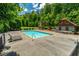 Community pool with lounge chairs and nearby covered seating area at 89 Somerset Ln, Cartersville, GA 30121