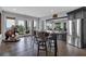 Bright dining area features a wooden table with seating, stainless appliances, and scenic views from the large windows at 89 Somerset Ln, Cartersville, GA 30121